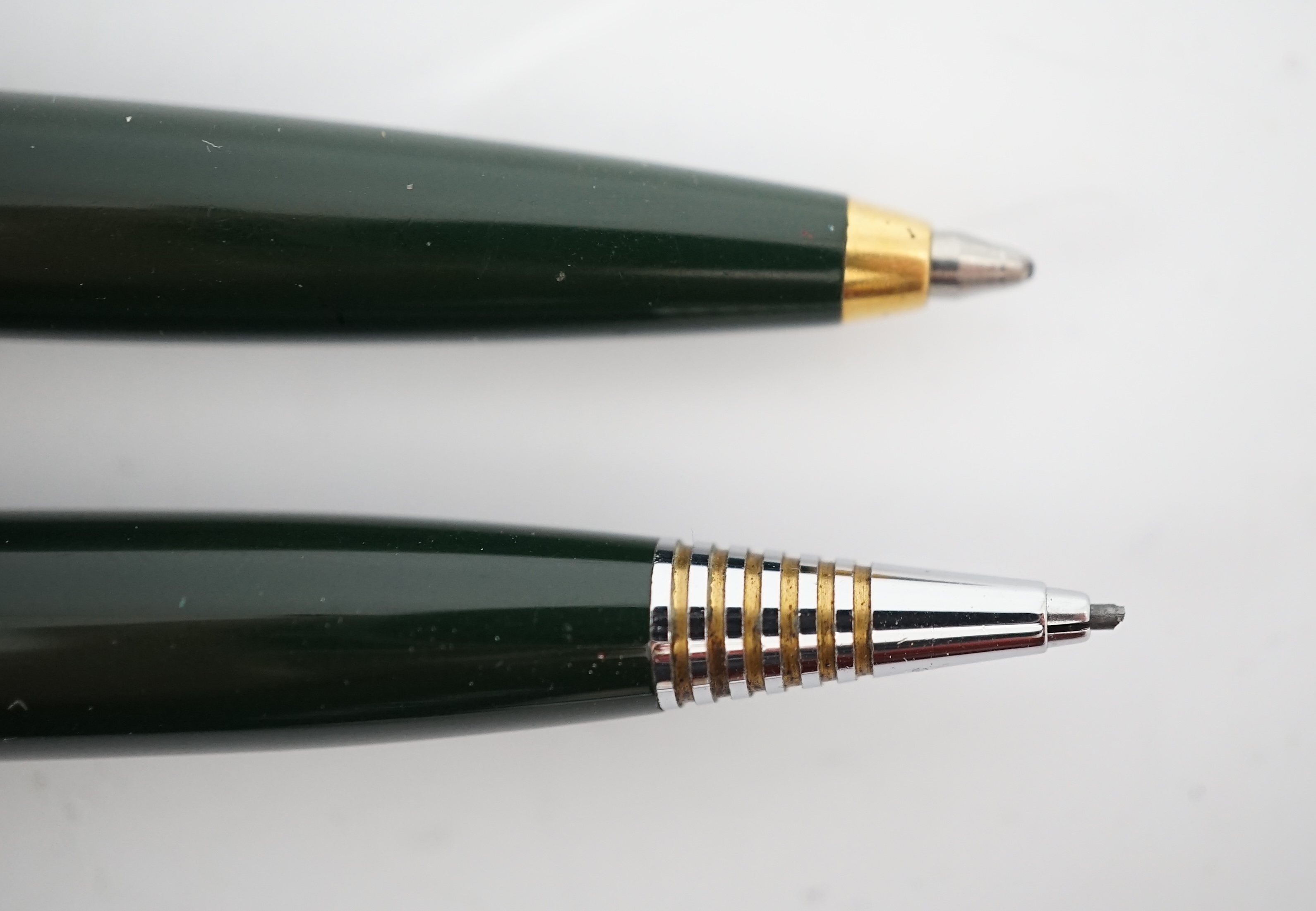 A Parker '51' Aerometric fountain pen, ball pen and pencil set in rare 'Forest Green'